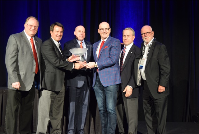 <p><em>Hallett (third from left) accepts the&nbsp;Ed Bobit Industry Icon award from remarketing industry professionals. (From left to right, Tony Long of IARA; Tim Meta of IARA; Warren Clauss of NAAA; Hallett; Frank Hackett of NAAA; and Bob Rauschenberg of ADESA.)</em></p>