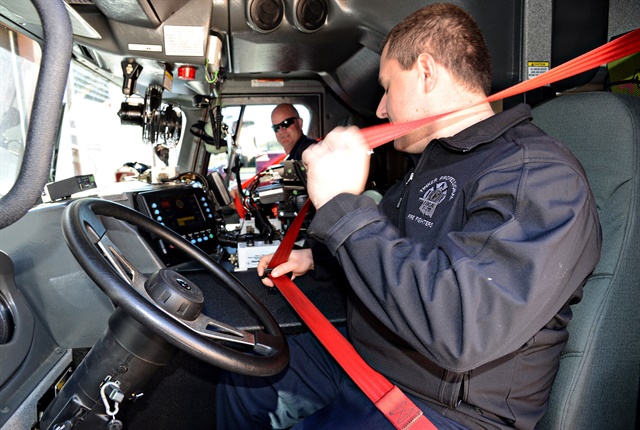 <p><em>Photo of truck driver buckling seatbelt courtesy of U.S. Air Force.</em></p>